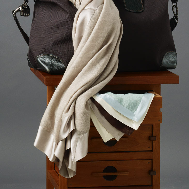 Our travel blanket that says First Class.